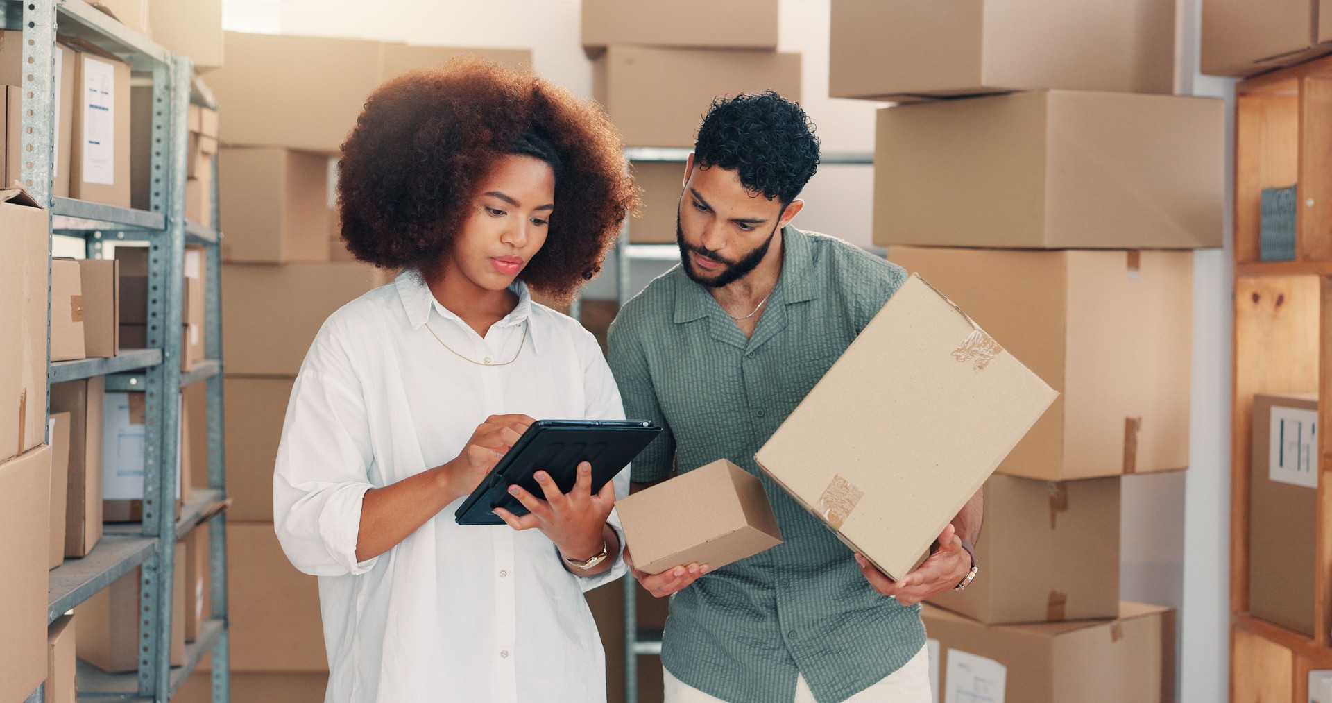 Team, logistics and people on tablet with boxes for discussion, inventory or stock backlog. Shipping, planning and supply chain for distribution, ecommerce package or business delivery in warehouse